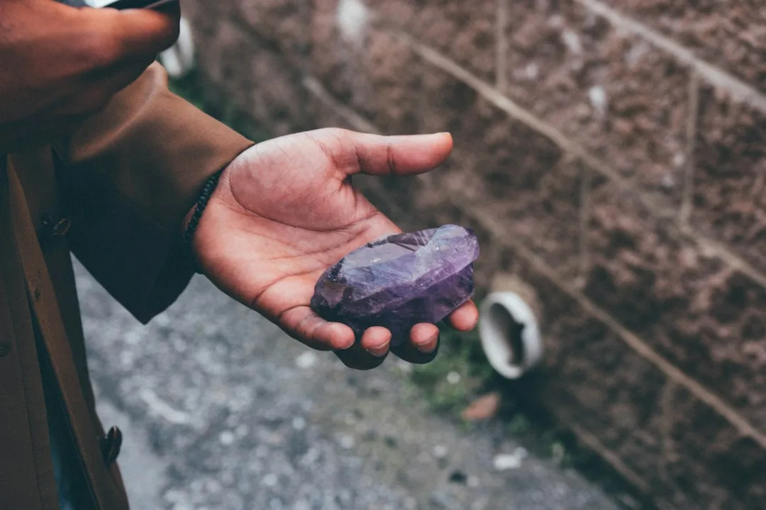 A worker running a hand over a freshly honed stone surface